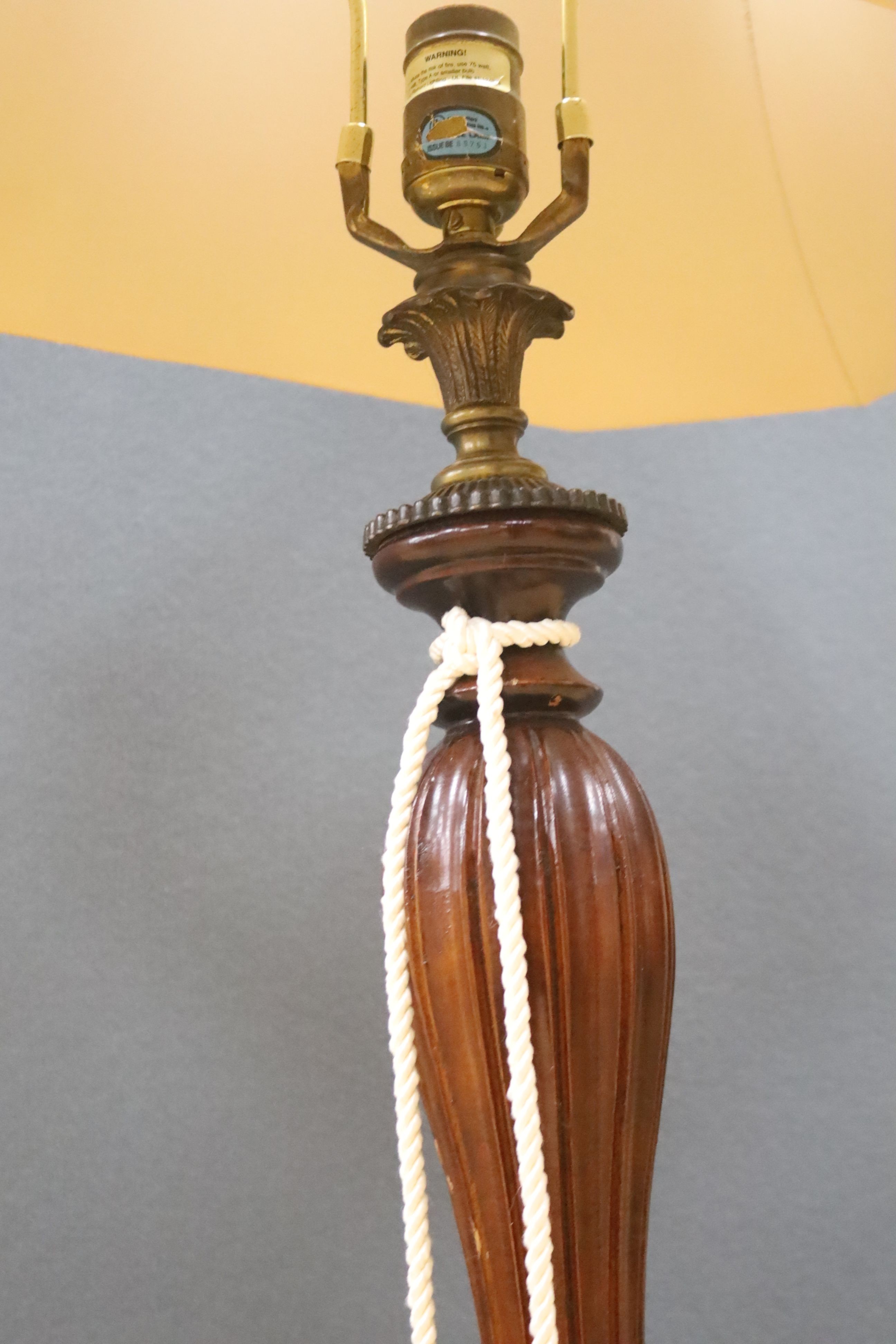 A pair of carved and giltwood table lamps and shades, overall height 100cm